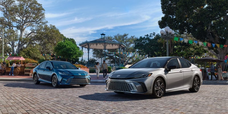 2026 Toyota Camry sedans displayed in an outdoor plaza setting