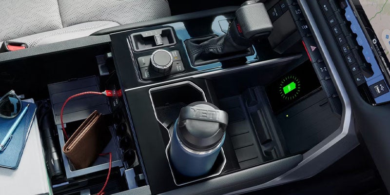 Toyota Tundra Center console with cup holders, storage compartments, and electronic controls.